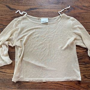 Shiny, sheer gold, mid length sleeves shirt